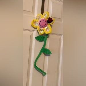 Plush stroller toy easily wraps around handles of stroller or car seat.